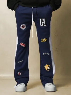 Flare Fit Contrast Panel Split Hem Sweatpants With All Over Embroidered Badge